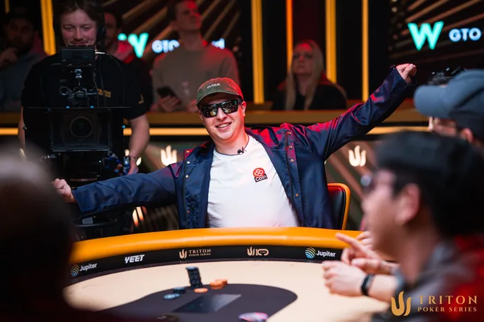 Aleks Ponakovs celebrating at the Triton SHRS Jeju 2026 $20K NLH final table on the feature stage