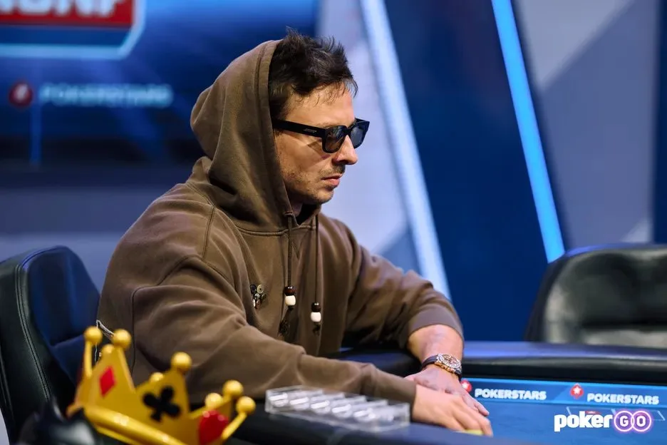 Sam Senor Tilt Kiki wearing a hoodie and sunglasses at a televised high-stakes cash game table