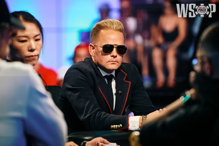 Lauri Saaskilahti in sunglasses and a navy blazer at the WSOP 2026 Main Event final table