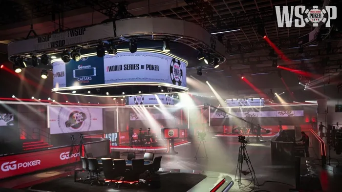 The empty WSOP 2026 Main Event final table set under the lights at the Horseshoe Events Center with ESPN cameras in position