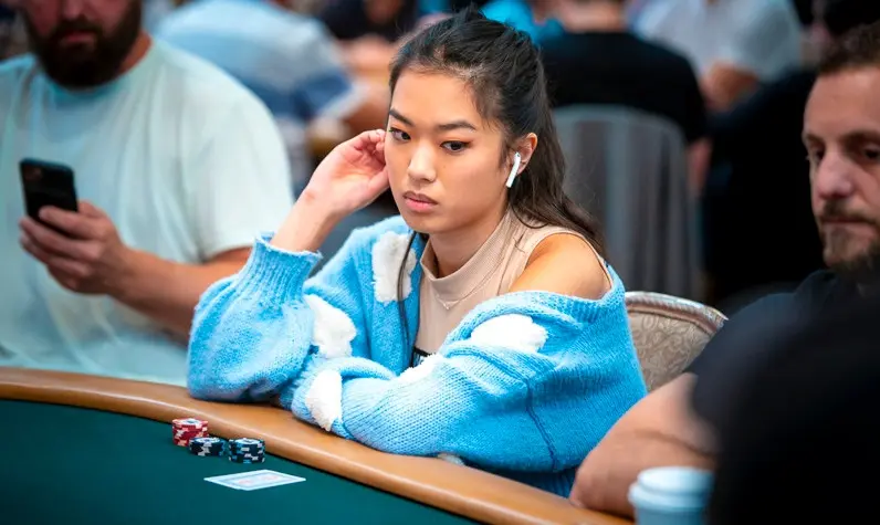 Qiyu Nemo Zhou, Woman Grandmaster and Twitch streamer, at a live poker tournament table
