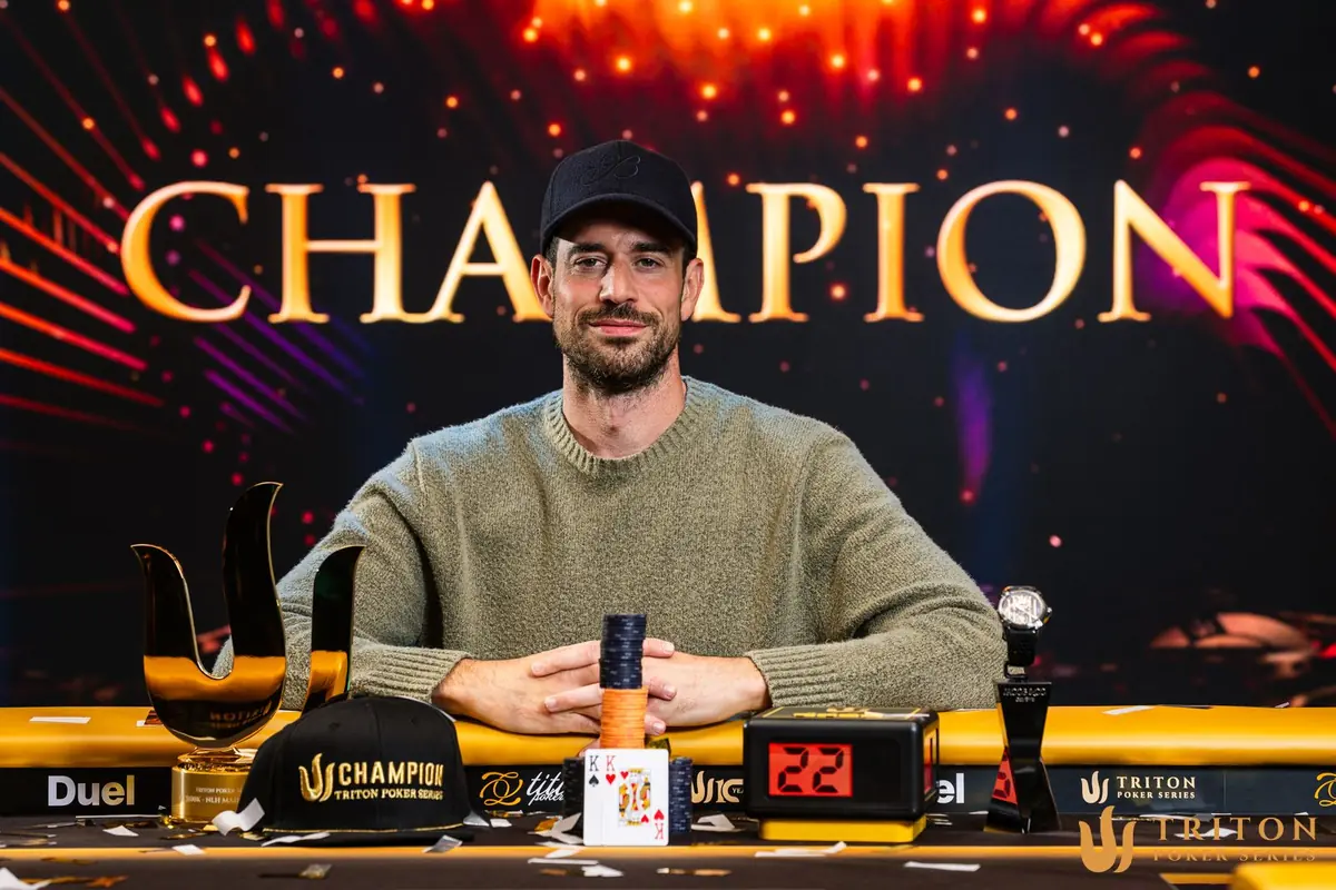 Nick Schulman with the Triton Main Event trophy, champion cap and Jacob and Co timepiece after winning the $100,000 Jeju II Main Event