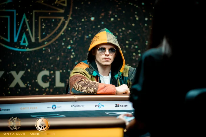 Ossi Ketola in a patchwork hoodie and sunglasses at the heads-up table at Onyx Club, Merit Poker, North Cyprus